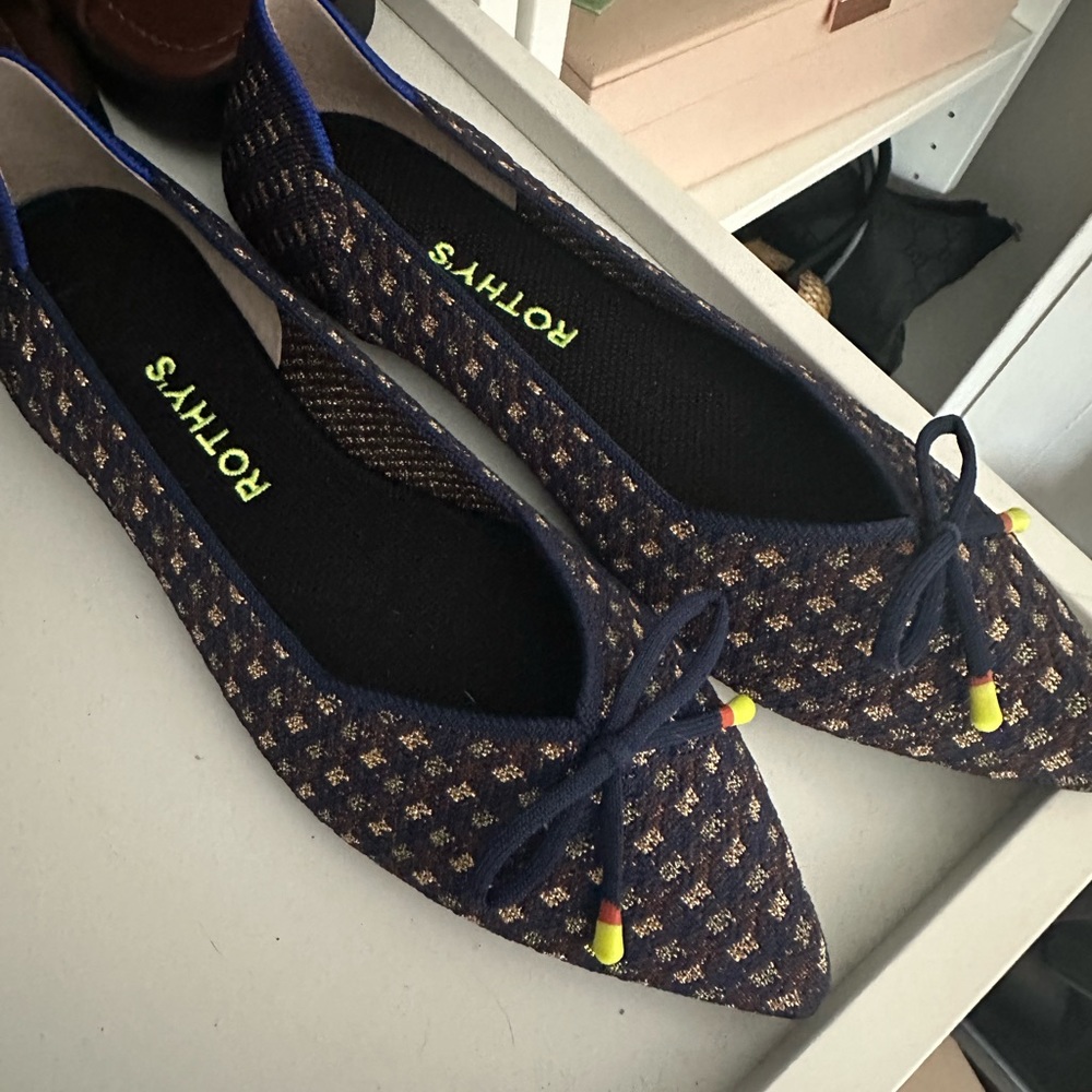 Navy and gold Rothy’s